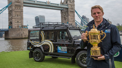 Man holding Rugby World Cup trophy