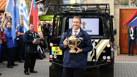 Man holding Rugby World Cup trophy