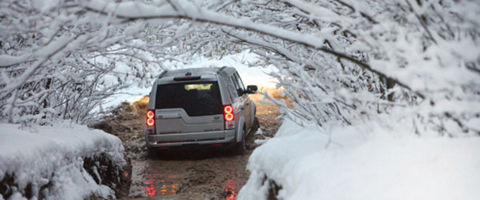 Land Rover vehicle driving through water