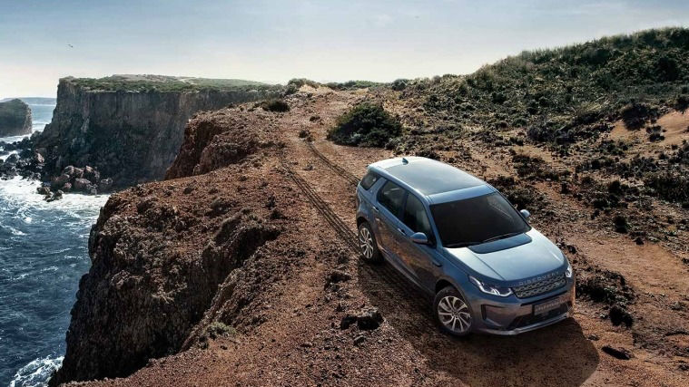 Land Rover Discovery driving off-road on a cliff