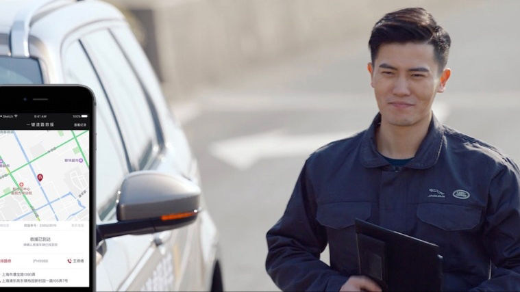 A person standing next to a vehicle