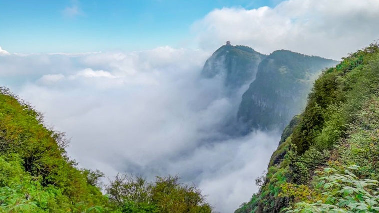 A mountain range blanketed by clouds