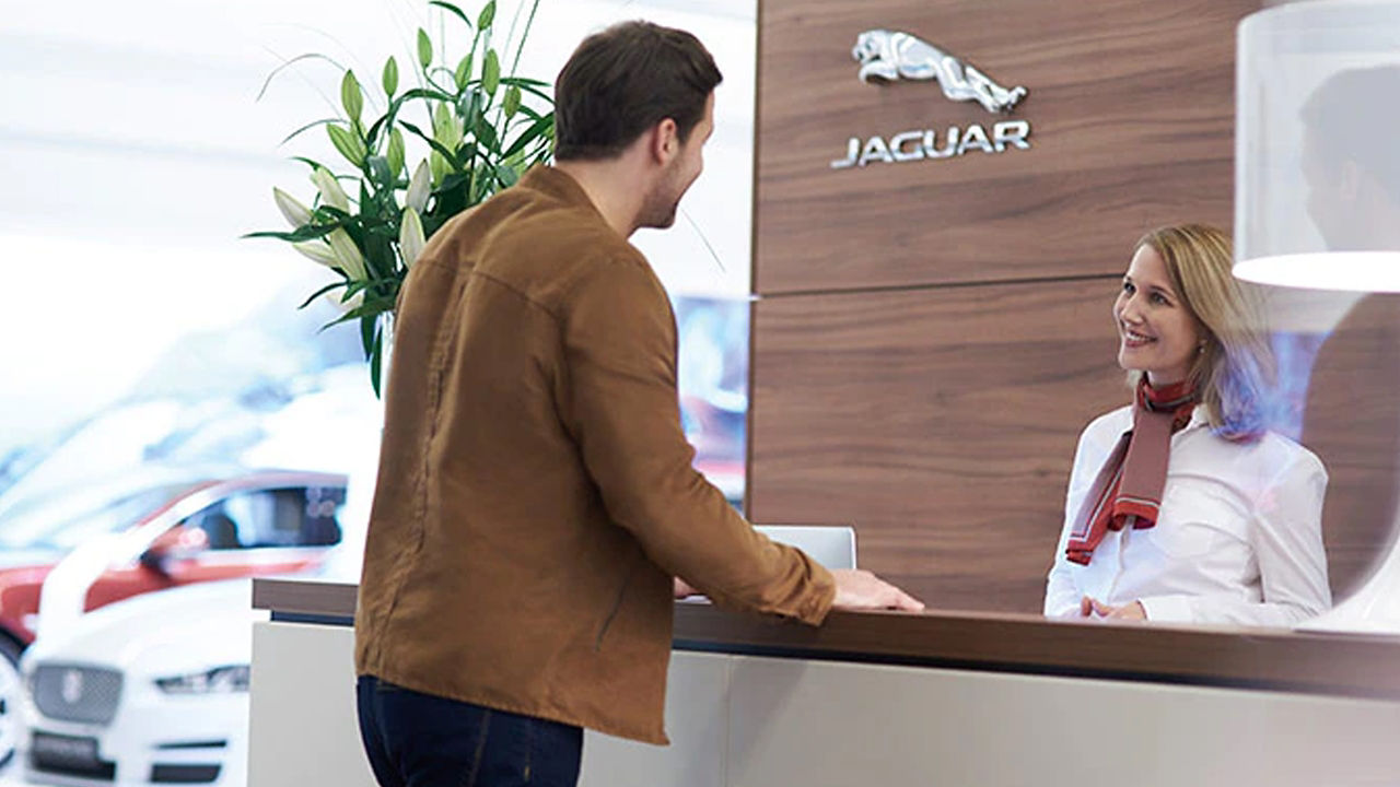 Jaguar receptionist handling customer  