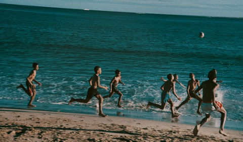 Children running on a beach
