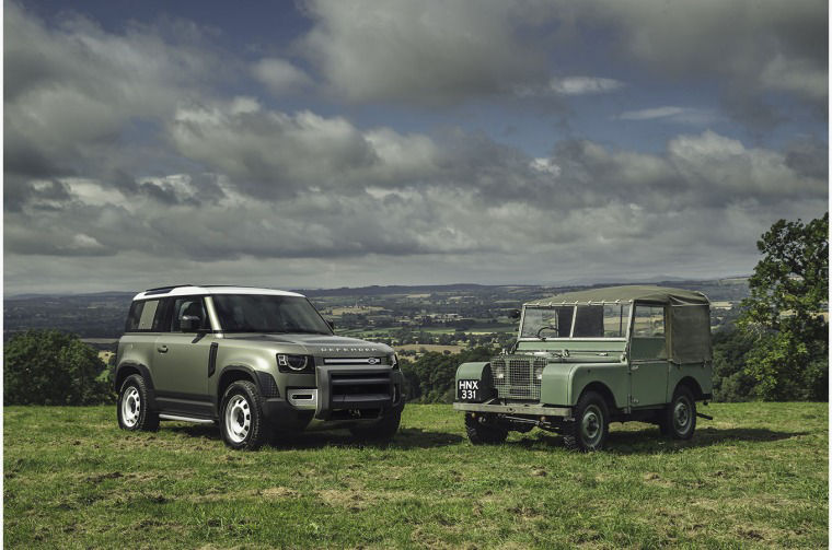 New Land Rover Defender next to Classic Land Rover Series I