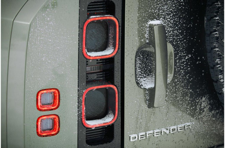Close up of Land Rover Defender lettering and tail lights