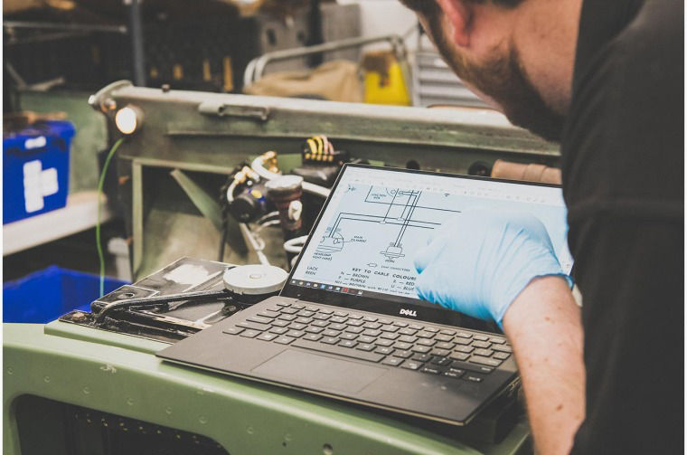 The restoration team checking schematics