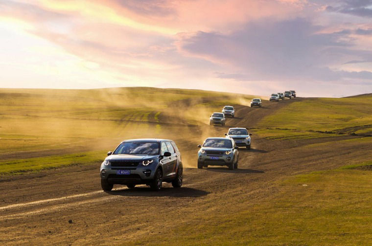 Range Rover vehicles driving down a road