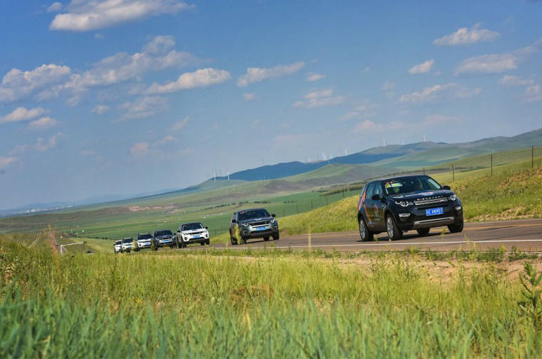 Range Rover vehicles driving down a road