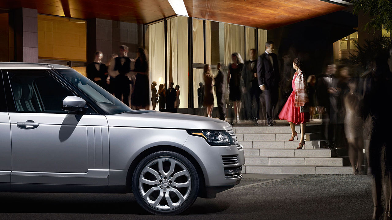 Range Rover parked outside luxury hotel