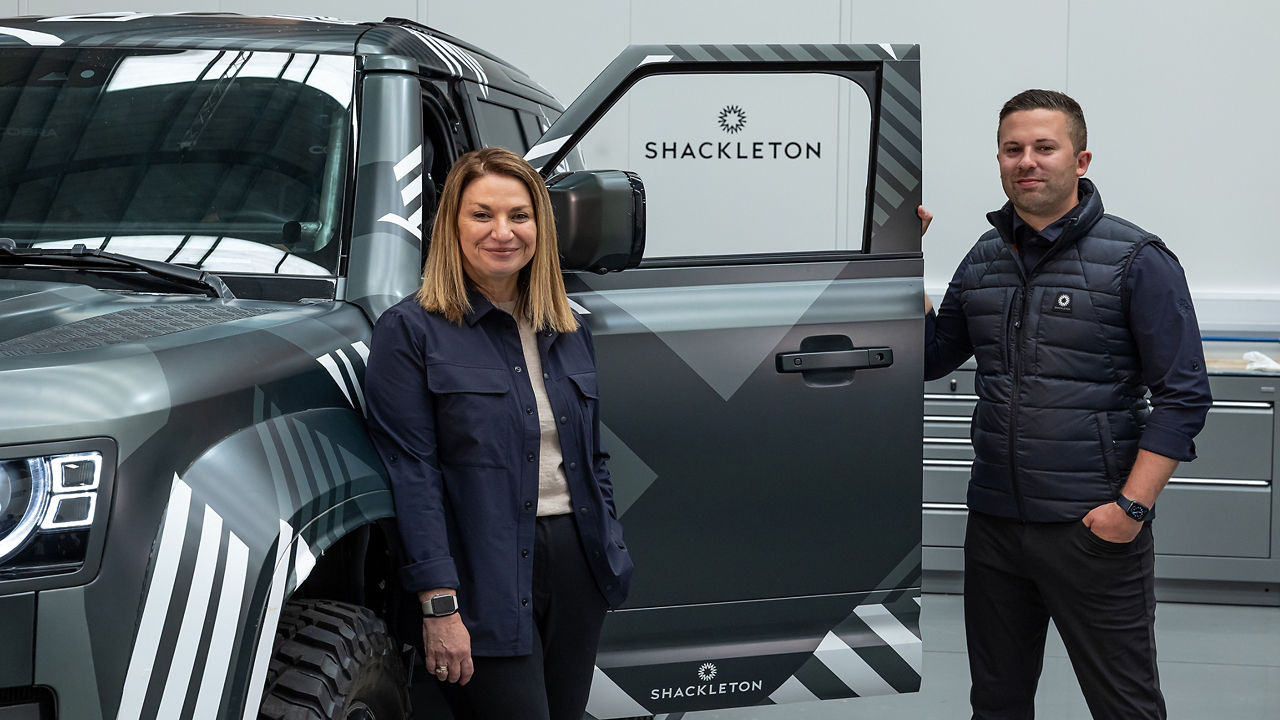 Shackleton team standing with Defender